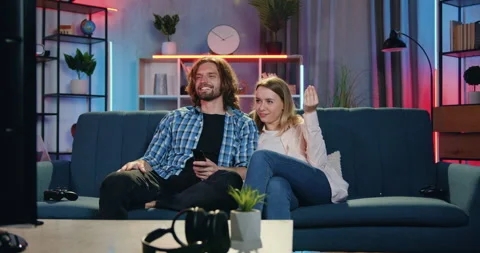 Good-looking happy smiling loving young couple talking between each other while Stock Footage 158086673