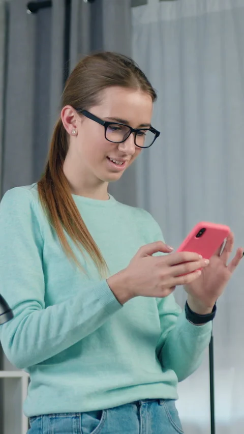 Good-looking in high spirits emotional young female person in casual clothes sta Stock Footage 332874097