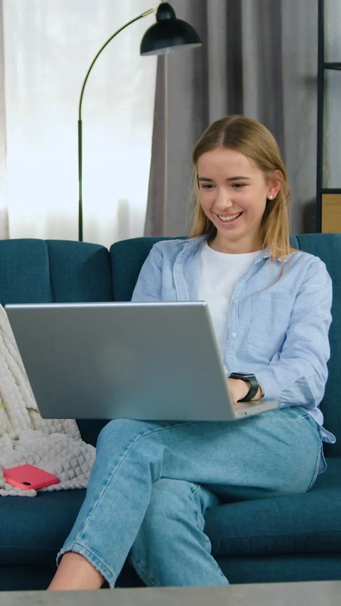 Good-looking joyful happy contented 20-aged light haired girl in casual wear sit Stock Footage 331436665