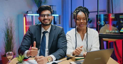 Good-looking joyful successful experienced multicultural male and female office Stock Footage 166708033