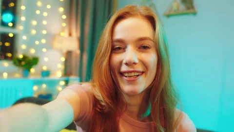 Good looking with a large smile ginger hair lady recording video on her camera Stock Footage 146475784