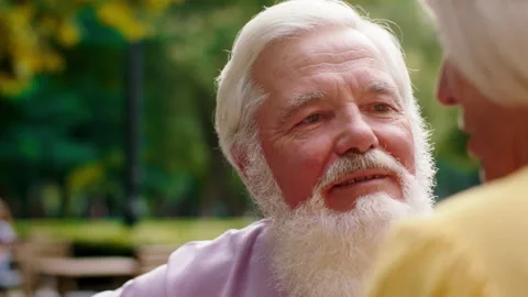 Good looking old man with a large smile and his wife have a romantic time at the Stock Footage 164766258