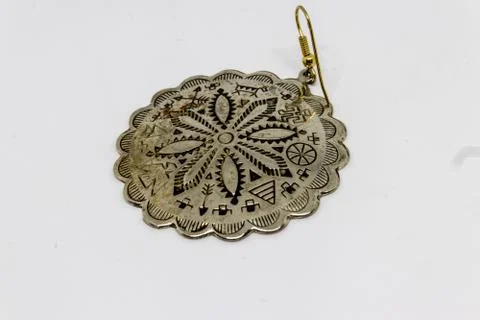 A good looking old silver badge with flower pattern closeup Stock Photos
