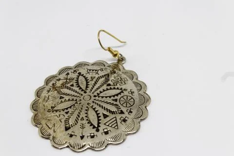 A good looking old silver badge with flower pattern Foto stock