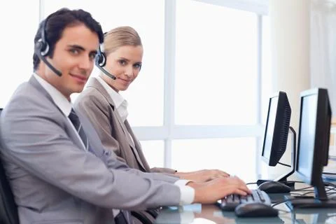 Good looking operators using a computer 스톡 사진