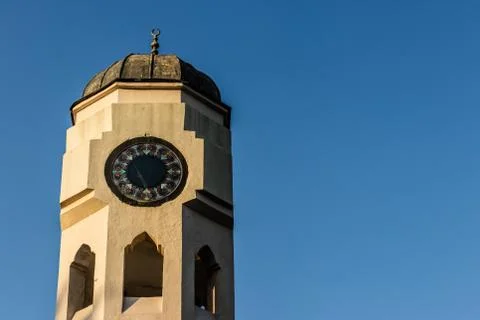 A good looking perspective shoot to a dome shaped clock tower - clean blue sk Stock Photos