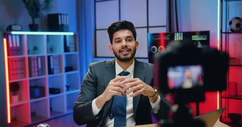 Good-looking positive confident skilled bearded office manager in suit holding Stock Footage 166557084