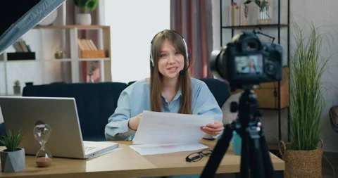 Good-looking positive experienced young long-haired woman in headphones Stock Footage 154735625