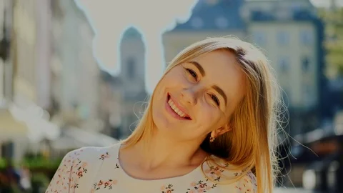 Good-looking satisfied 30-aged girl with straight hair smiling on the background Stock Footage 112348550