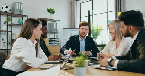 Good-looking satisfied confident skilled mixed race business team putting their Stock Footage 159560537