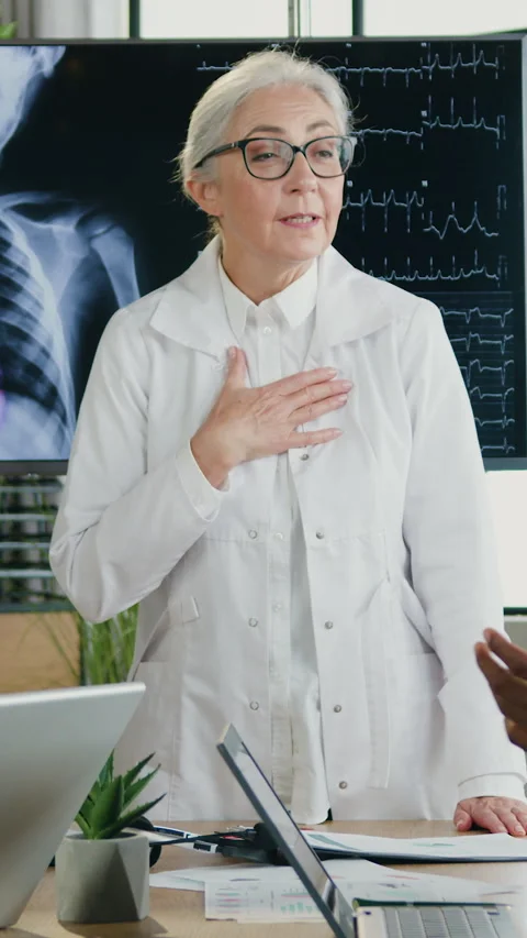 Good-looking satisfied skilled multicultural medics clapping hands to thank for  Stock Footage 331871392