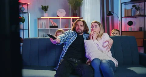 Good-looking scared bearded husband embracing his frightened wife during Stock Footage 158020041