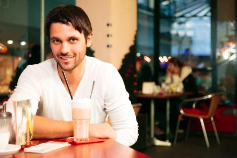 Good-looking Single Guy Sitting In A Cafe 写真素材