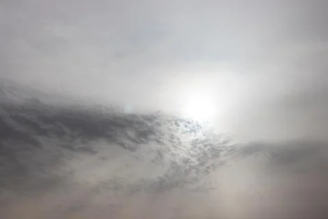 Good looking sky with clouds covered the bright sun Stock Photos