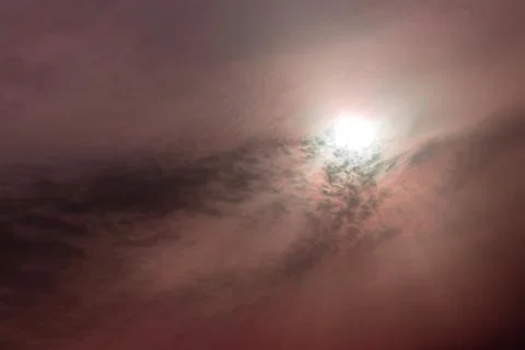 Good looking sky with clouds covered the red sun Stock Photos