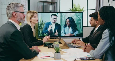 Good-looking smart professional experienced mixed race businesspeople advising Stock Footage 161018374