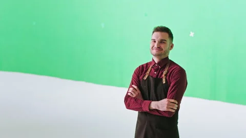 Good looking smiling cute bartender man in a chroma key studio posing in front 스톡 동영상 140354195