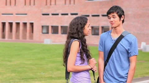 Good looking students flirting Stock Footage
