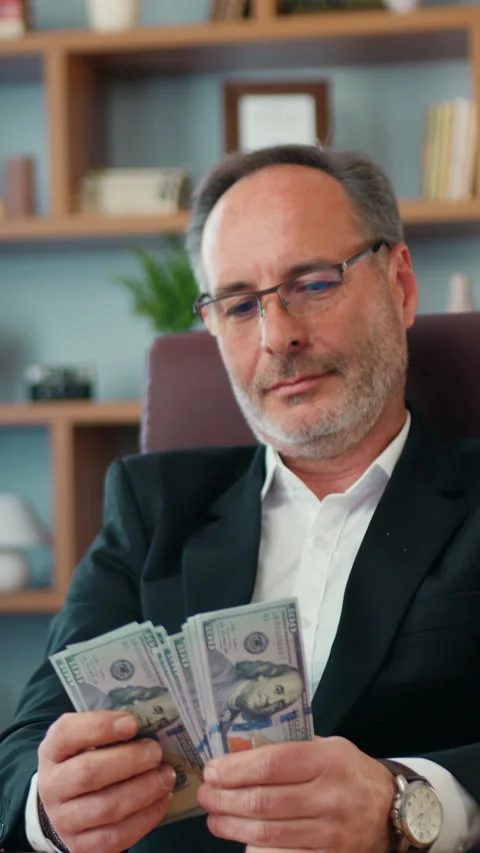 Good-looking successful high-skilled bearded ceo in business suit wears glasses  Stock Footage 327987857