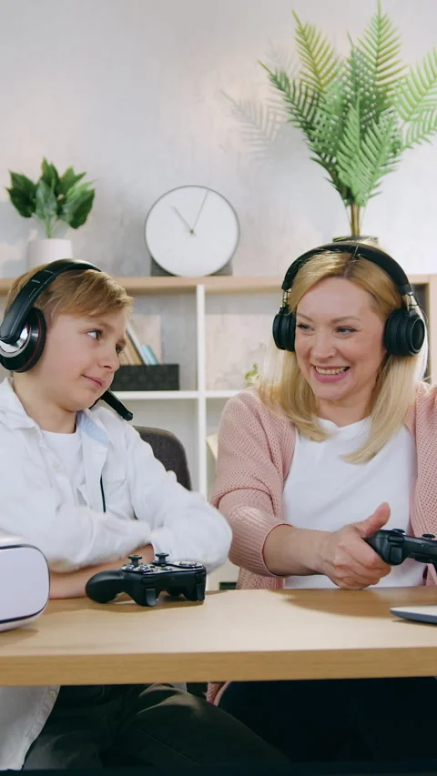 Good-looking upset 12-aged boy making unhappy face when lost the videogame durin Stock Footage 331206463