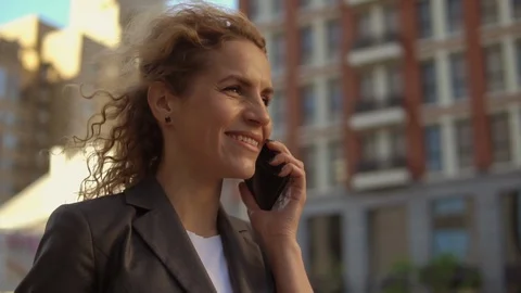 Good looking woman using her mobile phone Stock Footage 92035867