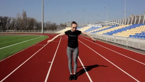 Good looking young active fit girl workout doing leg stretch exercise to warm up Stock Footage 137542613