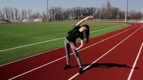 Good looking young active fit girl workout upper body leg stretch exercise squat Stock Footage 137542616