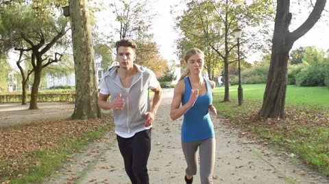 Good-Looking Young Couple Jogging In The Afternoon Stock Footage 42161114