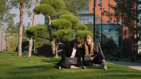 Good looking young couple students have a break time they take a sit at fresh Video stock 163518699