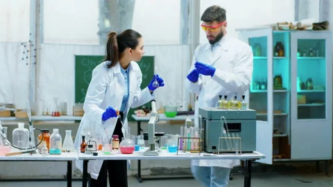 Good looking young pharmaceutical students working together on a project they Stock Footage 153078627