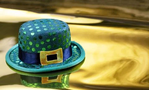Good luck hat for Saint Patrick day on gold background Stock Photos