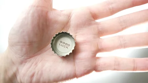 Good Luck printed on a bottle cap coming into view Stock Footage 255105563