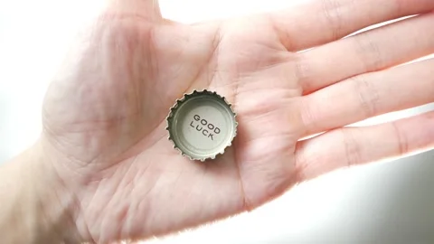 Good Luck printed on a bottle cap coming into view Stock Footage 255105570