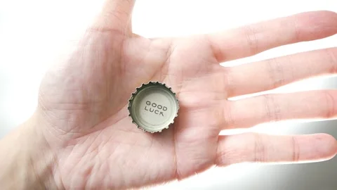 Good Luck printed on a bottle cap coming into view Stock Footage 255105813