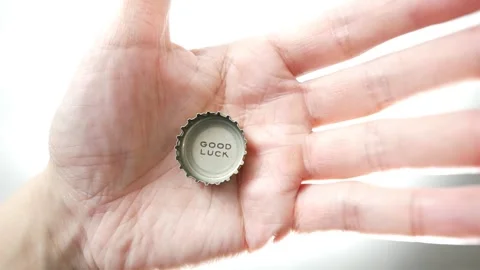 Good Luck printed on a bottle cap coming into view Stock Footage 255105814
