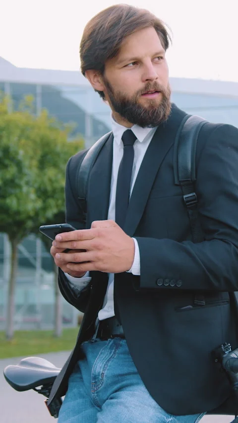 Good-natured satisfied modern 30-aged male person with well-groomed beard dresse Stock Footage 325457739