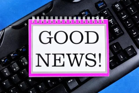 Good news. - text message in Notepad on the PC keyboard. Stock Photos