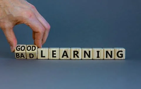 Good or bad learning symbol. Businessman turns cubes, changes words 'bad lear Stock Photos
