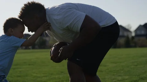 Good parenting dad playing ball with his sons Stock Footage 89922192