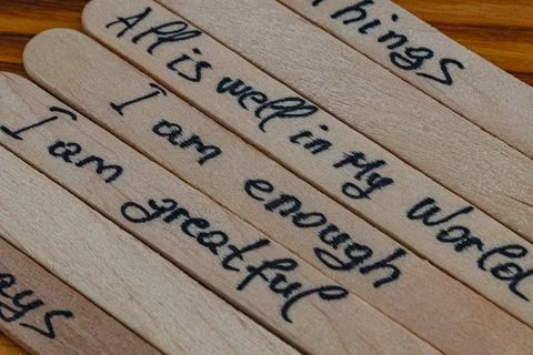 Good positive thoughts to increase self esteem are written on wooden sticks Stock Photos