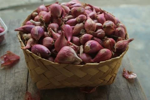 Good quality shallots and red onions in Indonesia for cooking in bamboo baske Stock Photos