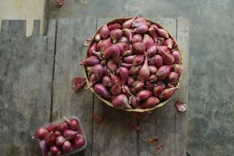 Good quality shallots and red onions in Indonesia for cooking in bamboo baske Stock Photos