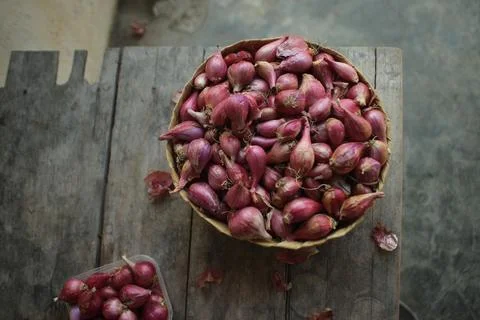 Good quality shallots and red onions in Indonesia for cooking in bamboo baske Stock Photos