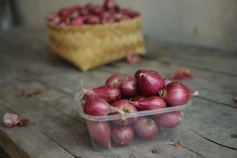 Good quality shallots and red onions in Indonesia for cooking in bamboo baske Stock Photos