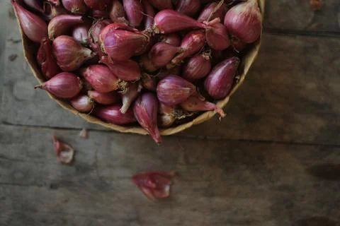 Good quality shallots and red onions in Indonesia for cooking in bamboo baske Stock Photos