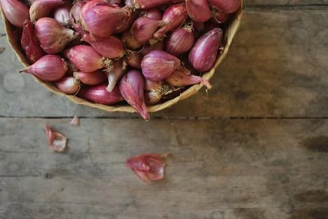 Good quality shallots and red onions in Indonesia for cooking in bamboo baske Stock Photos