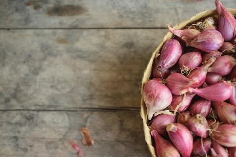 Good quality shallots and red onions in Indonesia for cooking in bamboo baske Stock Photos