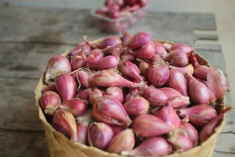 Good quality shallots and red onions in Indonesia for cooking in bamboo baske Stock Photos