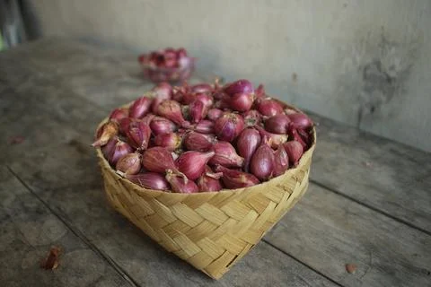 Good quality shallots and red onions in Indonesia for cooking in bamboo baske Stock Photos
