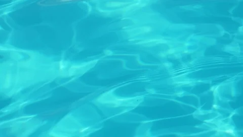 Good view of a clear blue tranquil water in a pool. Summer background of a water Видео 114779047